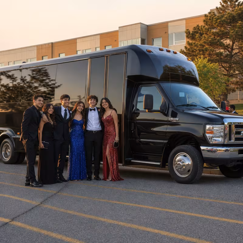 Group boarding a white charter bus for Prom & Homecoming Transportation transportation in Pittsburgh