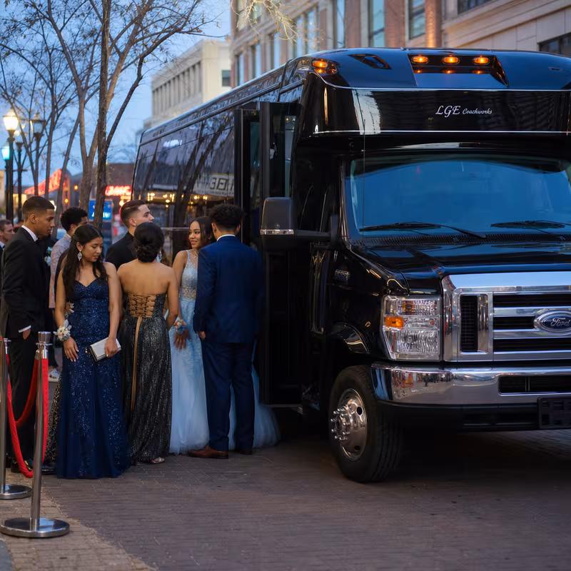Passengers loading luggage while boarding an Pittsburgh group shuttle