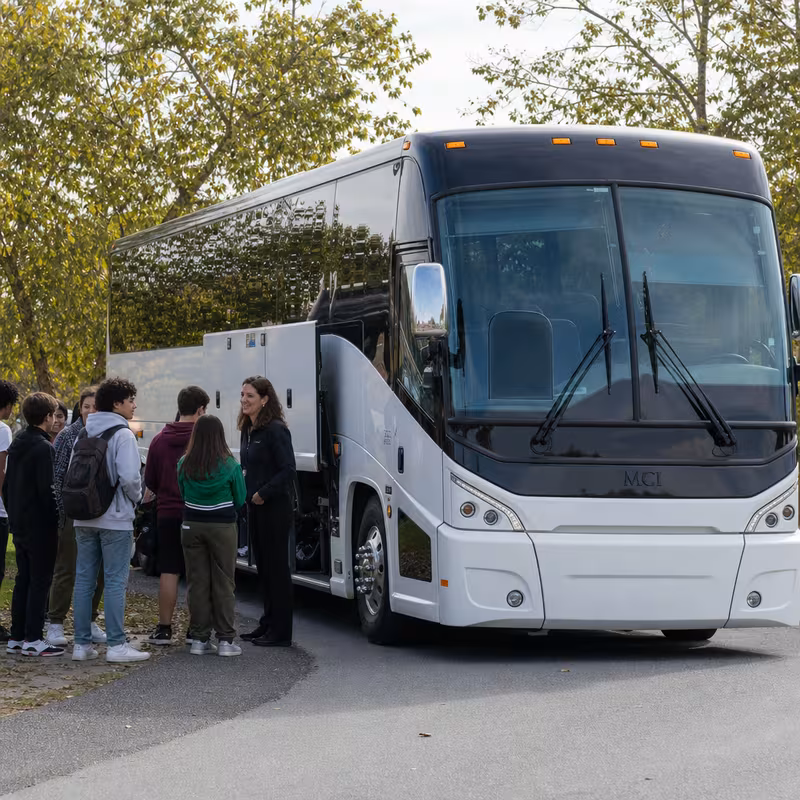 Black Mercedes Sprinter van staged for an Pittsburgh School Transportation group
