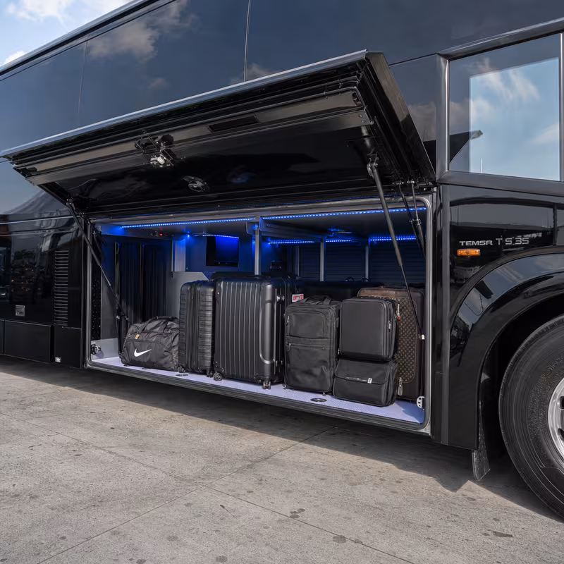 Party bus interior with wraparound leather seating and LED lighting in Pittsburgh