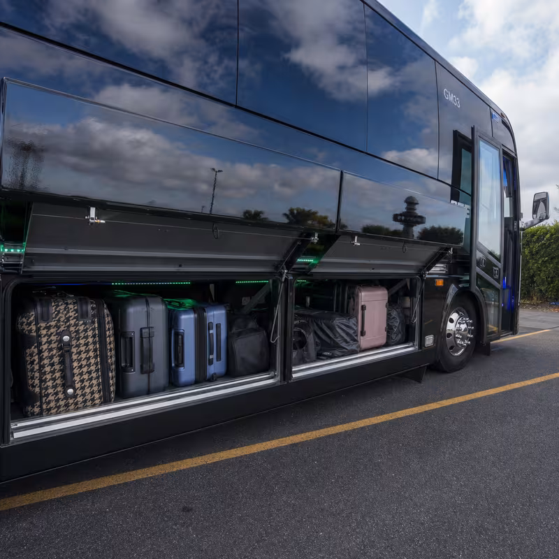 Party bus interior with wraparound leather seating and LED lighting in Pittsburgh