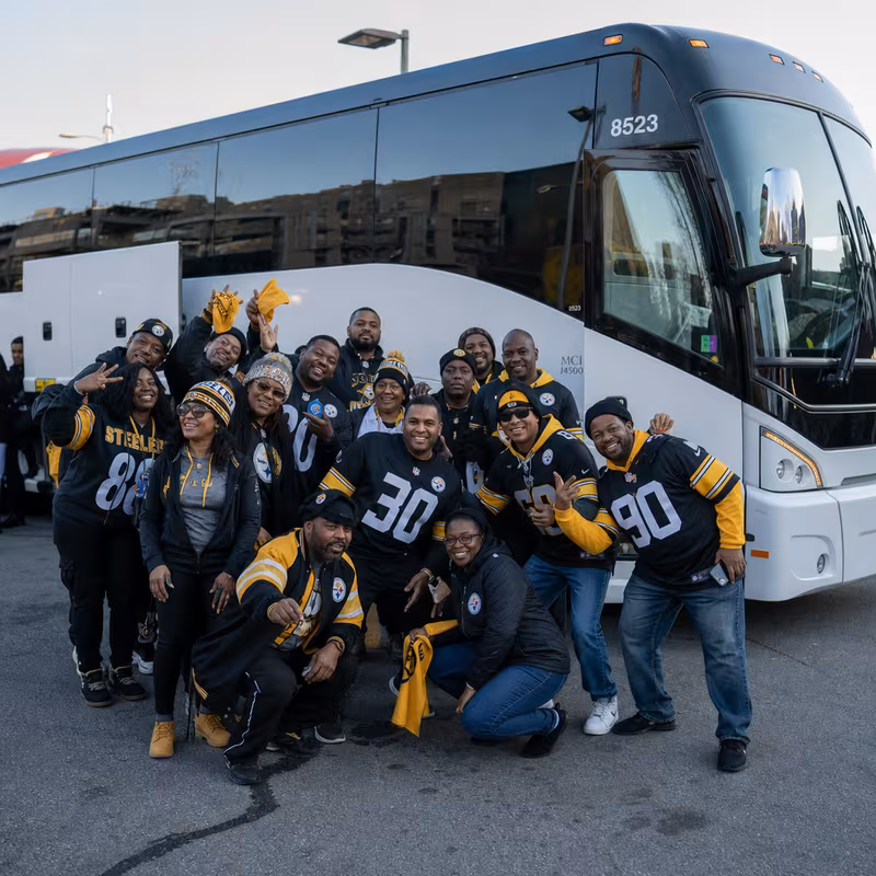 Passengers loading luggage while boarding an Pittsburgh group shuttle