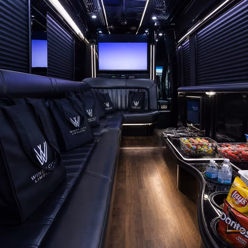 Party bus interior with wraparound leather seating and LED lighting in Pittsburgh