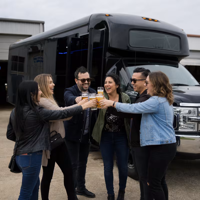 Passengers loading luggage while boarding an Pittsburgh group shuttle